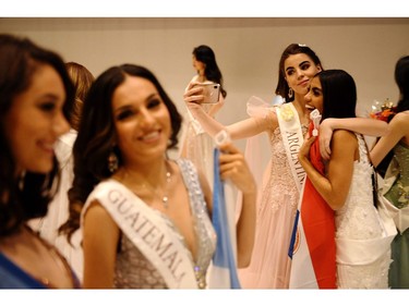 Contestants interact at the end of the the Miss World Final 2019 at the Excel arena in east London on Dec. 14, 2019.