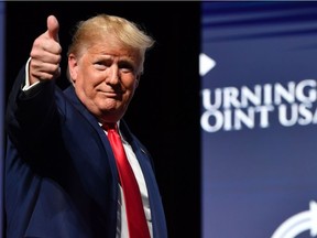 US President Donald Trump gestures during the Turning Point USA Student Action Summit at the Palm Beach County Convention Center in West Palm Beach, Florida on December 21, 2019.