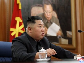 This undated handout photo released by North Korea's official Korean Central News Agency (KCNA) on December 22, 2019 shows North Korean leader Kim Jong Un attending the Third Enlarged Meeting of the Seventh Central Military Commission of the Workers' Party of Korea (WPK) in an undisclosed location.