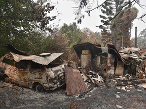 A house and van are seen destroyed after bushfires ravaged the town of Bilpin, 70 km west of Sydney on Dec. 29, 2019.