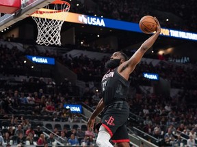 Houston Rockets guard James Harden goes up for a dunk in the second half against the San Antonio Spurs at the AT&T Center.