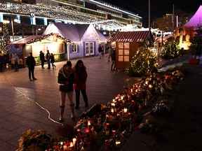 People re-enter a Christmas market in Berlin, Germany, on December 21, 2019, that was the scene of a fatal attack three years ago to investigate a suspicious object. (REUTERS/Annegret Hilse)