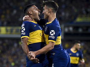 Ramon Abila of Boca Juniors celebrates with teammate Nicolas Capaldo after scoring against Argentinos Juniors at Estadio Alberto J. Armando on November 30, 2019 in Buenos Aires. (Marcelo Endelli/Getty Images)