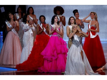 Contestants react on stage during the Miss World final in London, Britain on Dec. 14, 2019.