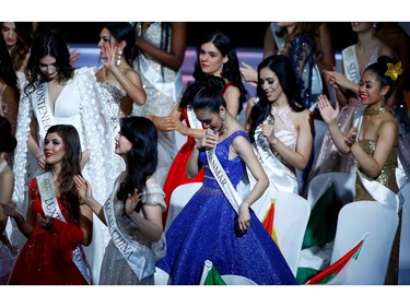 Than Htet San of Myanmar reacts on stage during the Miss World final in London, Britain Dec. 14, 2019.