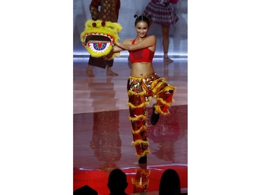 Lila Lam of Hong Kong performs on stage during the opening ceremony of the Miss World final in London, Britain on Dec. 14, 2019.