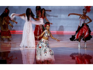 Bhasha Mukherjee of England performs on stage during the opening ceremony of the Miss World final in London, Britain on Dec. 14, 2019.