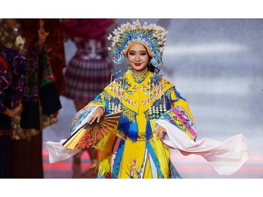 Peishan Li of China performs on stage during the opening ceremony of the Miss World final in London, Britain on Dec. 14, 2019.