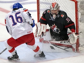 Canada's Joel Hofer makes the save on Czech Republic's Otakar Sik during action at the World Junior Championships on Tuesday, December 31, 2019 in Ostrava, Czech Republic. (THE CANADIAN PRESS/Ryan Remiorz)