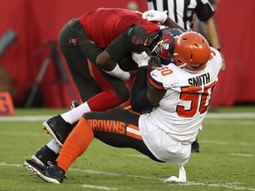 Cleveland Browns defensive end Chris Smith (50) sacks Tampa Bay Buccaneers quarterback Jameis Winston (3) at Raymond James Stadium. (Kevin Jairaj-USA TODAY Sports)