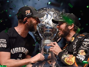 Crew chief Cole Pearn (left) and driver Martin Truex Jr. celebrate winning the Monster Energy Cup Series Championship at Homestead, Fla., in 2017. (GETTY IMAGES)