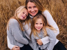 Sarah Cotton holds her daughters Chloe, left, and Aubrey Berry in October 2017 in this handout photo. (THE CANADIAN PRESS/HO, Ryan MacDonald Photography)
