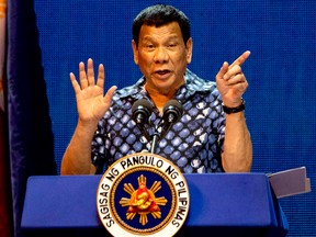 Philippine President Rodrigo Duterte gestures during the Partido Demokratiko Pilipino-LakasBayan (PDP-LABAN) meeting in Manila on May 11, 2019, ahead of the mid-term elections on May 13.