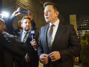 Elon Musk, chief executive officer of Tesla Inc., leaves the U.S. District Court, Central District of California through a back door in Los Angeles, on Dec. 3, 2019.