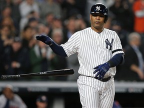 In this Oct. 17, 2019, file photo, New York Yankees designated hitter Edwin Encarnacion walks to load the bases against the Houston Astros during the first inning in game four of the 2019 ALCS playoff baseball series at Yankee Stadium in the Bronx.