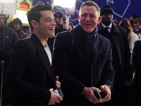 Actors Daniel Craig and Rami Malek talk during a promotional appearance on TV in Times Square for the new James Bond movie "No Time to Die" in the Manhattan borough of New York City, New York, U.S., December 4, 2019.