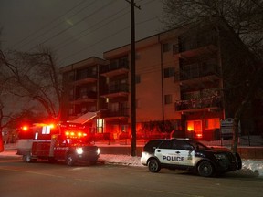 Fire investigators and police respond to an incident at an apartment building near 65 St. and 129 Ave., in Edmonton Tuesday Dec. 24, 2019.