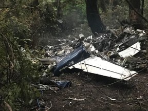 CP-Web.  The scene of a small plane crash on Gabriola Island, B.C., is shown on Wednesday, Dec.11, 2019. A plane that one witness describes as crashing in a "huge explosion" that left multiple people dead in British Columbia has been identified as a twin-engine propeller aircraft.