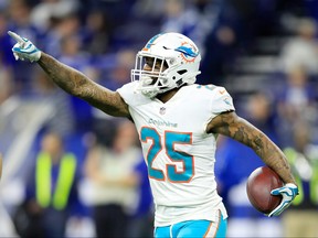 Xavien Howard of the Miami Dolphins celebrates after intercepting a pass in the final minute of the first half against the Indianapolis Colts at Lucas Oil Stadium on November 25, 2018 in Indianapolis, Indiana.