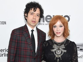 Geoffrey Arend and Christina Hendricks attend the 27th annual Elton John AIDS Foundation Academy Awards viewing party on Feb. 24, 2019 in West Hollywood, Calif.  (Jamie McCarthy/Getty Images for EJAF)