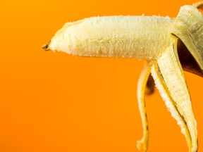 creative banana on orange background