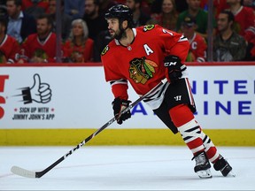 Brent Seabrook of the Chicago Blackhawks controls the puck against the San Jose Sharks during the home opening game at United Center on October 10, 2019 in Chicago, Illinois.