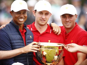 Playing Captain Tiger Woods, left, of the United States team, with Patrick Cantlay, centre, and Justin Thomas celebrate after winning the Presidents Cup at Royal Melbourne Golf Course on Dec. 15, 2019 in Melbourne, Australia. (Daniel Pockett/Getty Images)