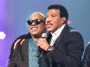 Stevie Wonder and honoree Lionel Richie perform onstage during the 2016 MusiCares Person of the Year honoring Lionel Richie at the Los Angeles Convention Center on February 13, 2016 in Los Angeles, California.