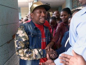 Nairobi's Senator Mike Sonko salutes residents as he arrives at a polling station to vote for the Jubilee Party primaries election on April 26, 2017 in Nairobi, to choose candidates ahead of parliament and local government.
(SIMON MAINA/AFP via Getty Images)