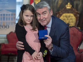 Sophia Grace LeBlanc is recognized for her heroism by Premier Stephen McNeil at a Medal of Bravery Award ceremony at Province House in Halifax on Wednesday, Dec. 4, 2019. (THE CANADIAN PRESS/Andrew Vaughan)