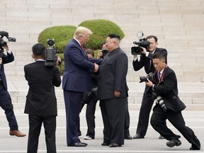 U.S. President Donald Trump meets with North Korean leader Kim Jong Un at the demilitarized zone separating the two Koreas, in Panmunjom, South Korea, June 30, 2019.