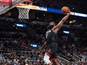 Houston Rockets guard James Harden goes up for a dunk in the second half against the San Antonio Spurs at the AT&T Center in San Antonio, Texas, on Tuesday, Dec. 3, 2019.