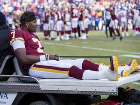 Dwayne Haskins #7 of the Washington Redskins is carted off the field after an injury during the second half of the game against the New York Giants at FedExField on Dec. 22, 2019 in Landover, Md.