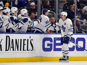 Toronto Maple Leafs center Auston Matthews is congratulated by teammates after scoring during the second period against the St. Louis Blues at Enterprise Center.