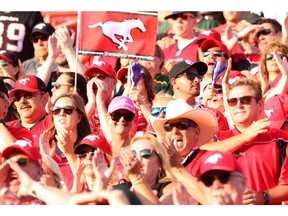 Fans are seen cheering on the Stamps during the second half of action as the Calgary Stampeders host their northern rival Edmonton Eskimos at McMahon Stadium on Saturday, August 3, 2019. Brendan Miller/Postmedia