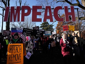 Protesters supporting the impeachment of U.S. President Donald Trump gather outside the U.S. Capitol Dec. 18, 2019 in Washington, D.C.