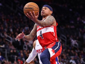 Isaiah Thomas of the Washington Wizards drives to the basket past Derrick Rose of the Detroit Pistons at Little Caesars Arena on December 16, 2019 in Detroit. (Gregory Shamus/Getty Images)