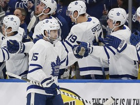 Maple Leafs forward Alex Kerfoot is congratulated by teammates after scoring in the first period against the Edmonton Oilers on Saturday night at Rogers Place. (Perry Nelson/USA TODAY Sports)