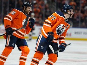 Oilers star forwards Connor McDavid (right) and Leon Draisaitl (left).