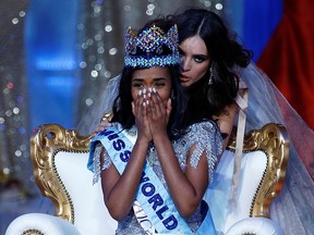 Toni Ann Singh of Jamaica celebrates winning next to Miss World 2018 Vanessa Ponce de Leon of Mexico during the Miss World final in London, Britain, Dec. 14, 2019.