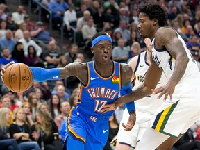 Oklahoma City Thunder guard Dennis Schroder (17) dribbles the ball as Utah Jazz centre Ed Davis (17) defends at Vivint Smart Home Arena. (Russ Isabella-USA TODAY Sports)