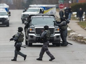 York Regional Police tactical officers at an armed standoff on Elmwood Ave., near Major Mackenzie Dr. and Bayview Ave. in Richmond Hill, on Friday, Dec. 27, 2019. (Ernest Doroszuk/Toronto Sun/Postmedia Network)