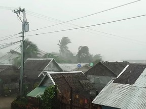 This handout image taken and received on December 2, 2019 courtesy of Gladys Vidal shows heavy rains and moderate wind from Typhoon Kammuri battering houses in Gamay town.  (HANDOUT/Courtesy of Gladys Vidal/AFP via Getty Images)