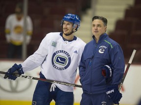 Vancouver, BC: MARCH 12, 2019 -- Vancouver Canucks head coach Travis Green and player Jay Beagle at team practice at Rogers Arena in Vancouver, BC Tuesday, March 12, 2019.