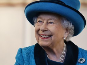 Queen Elizabeth II visits the new headquarters of the Royal Philatelic society in London on Nov. 26, 2019. (TOLGA AKMEN/AFP via Getty Images)
