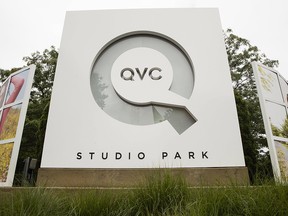 Corporate signage is shown outside a QVC facility in West Chester, Pa., Friday, July 7, 2017. (AP Photo/Matt Rourke)
