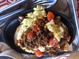 A hearty breakfast of scrambled eggs with onions, jalapenos and chorizo on toasted birote bread at La Panaderia, a bakery cafe in downtown San Antonio. The cafe-bakery is known for its bread and pan dulce (Mexican pastries).