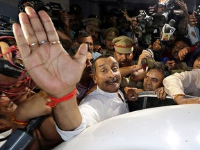 Kuldeep Singh Sengar, a legislator of Uttar Pradesh state from India's ruling Bharatiya Janata Party (BJP), reacts as he leaves a court after he was arrested on Friday in connection with the rape of a teenager, in Lucknow, India, April 14, 2018.