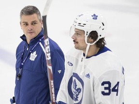 Toronto Maple Leafs head coach Sheldon Keefe (left) and forward Auston Matthews talk during the team's practice at the Ford Performance Centre in Toronto on Nov. 25, 2019. (CRAIG ROBERTSON/Toronto Sun files)