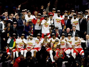 The Toronto Raptors pose for a photo after defeating the Golden State Warriors in Game 6 of the NBA Finals to claim the first league title in the franchise’s history.